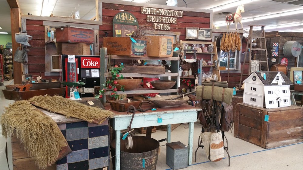 Anti-Monopoly Drug Store vintage display with crates, dough bowls and antique advertising at Ocala Antique Mall